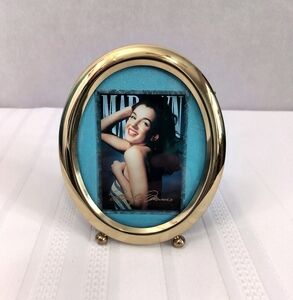 Elegant Solid Brass Oval Photo Frame Featuring A Marilyn Monroe Trading Card